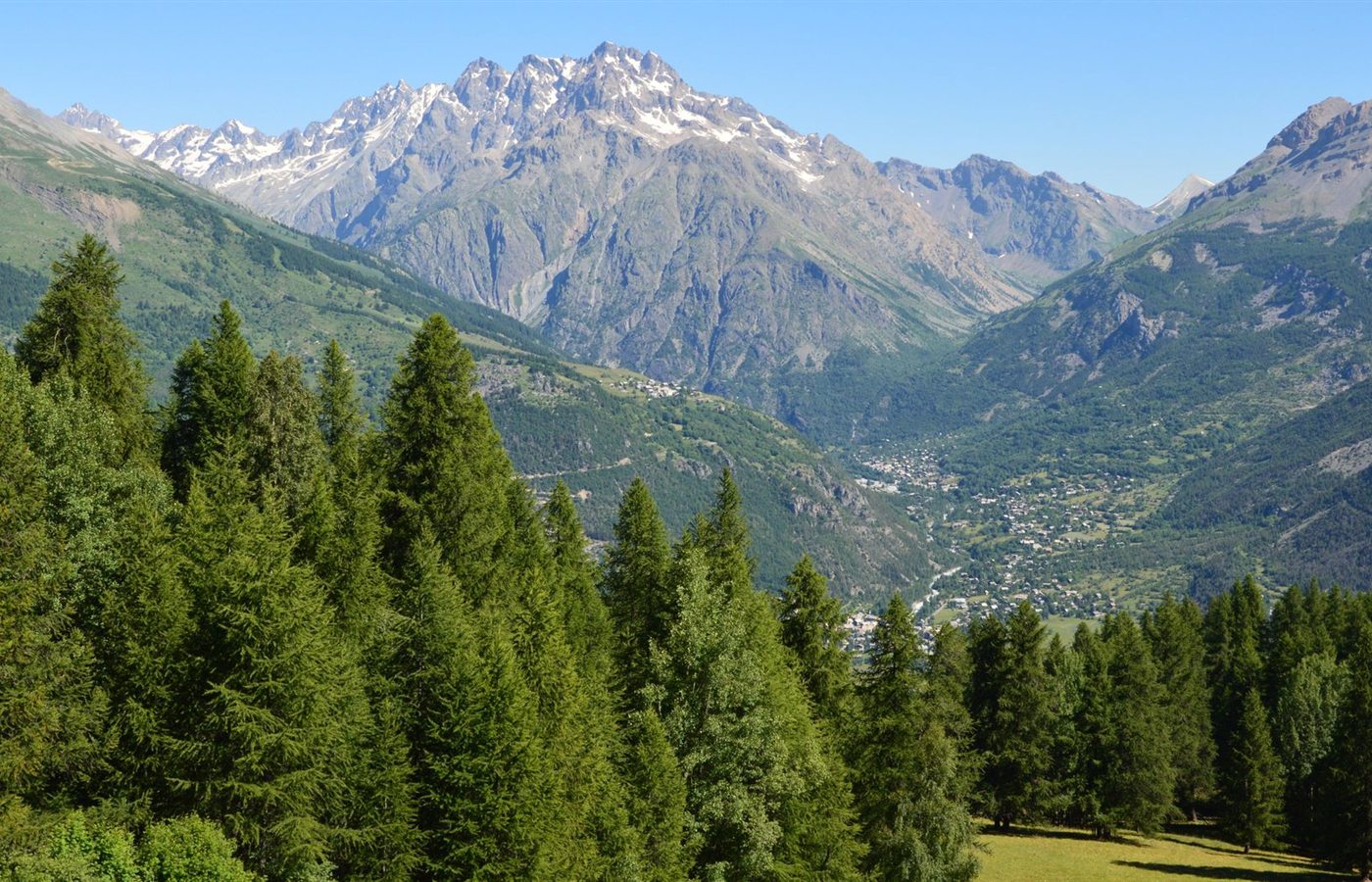 Breathtaking view of the Alps mountains and forest in Puy-Saint-Vincent, France.